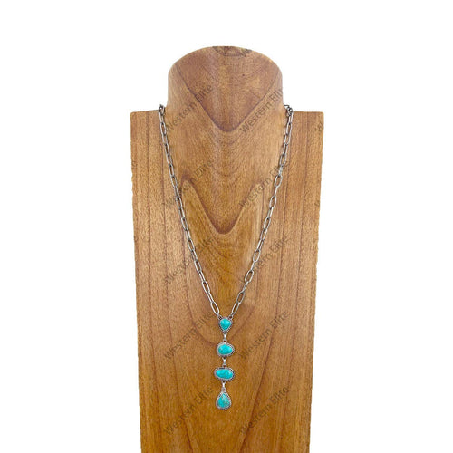 Necklace with turquoise stones on a wooden stand