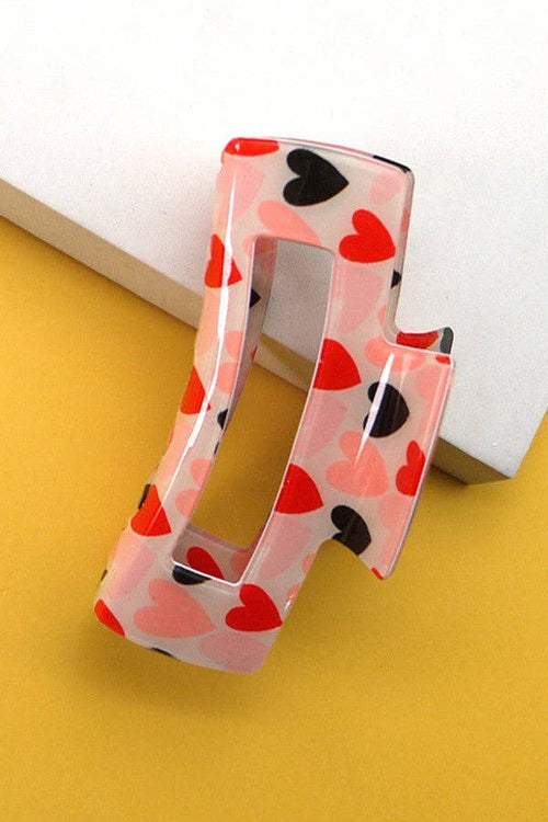 Heart pattern claw clip on a yellow background