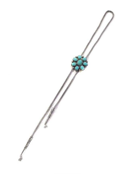 Silver bolo necklace with turquoise stones on a white background