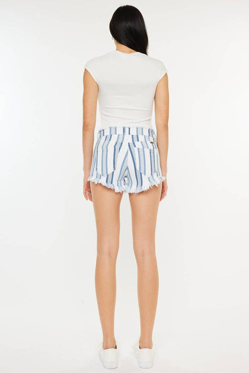 Person wearing a white sleeveless top and blue striped shorts on a white background