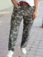 Person wearing camouflage pants on a paved surface