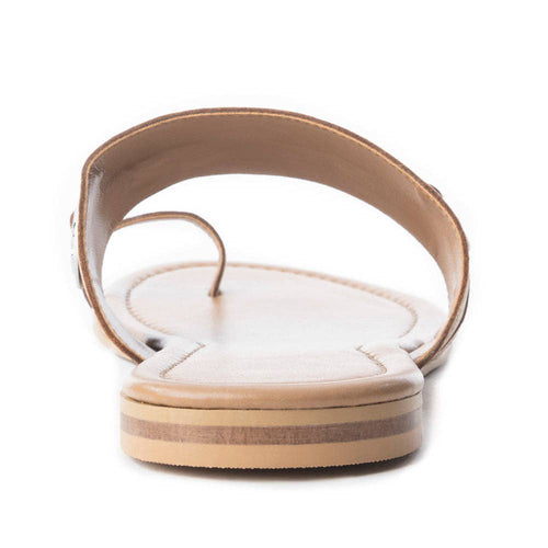 Beige sandal with a white sole on a white background