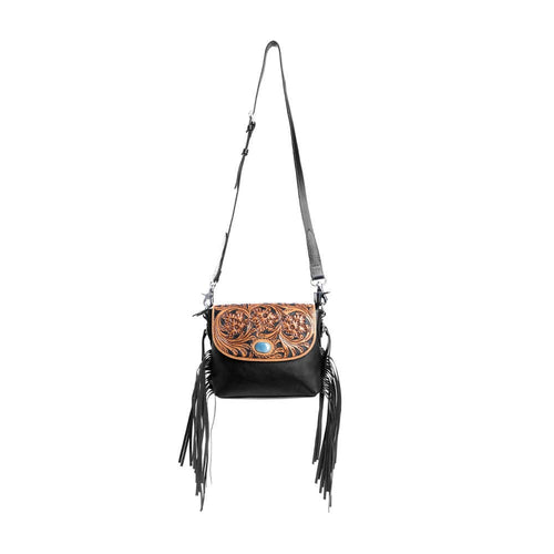 Black leather crossbody bag with brown floral design and fringes on a white background
