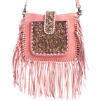Pink handbag with fringe and intricate tooled leather design on a white background