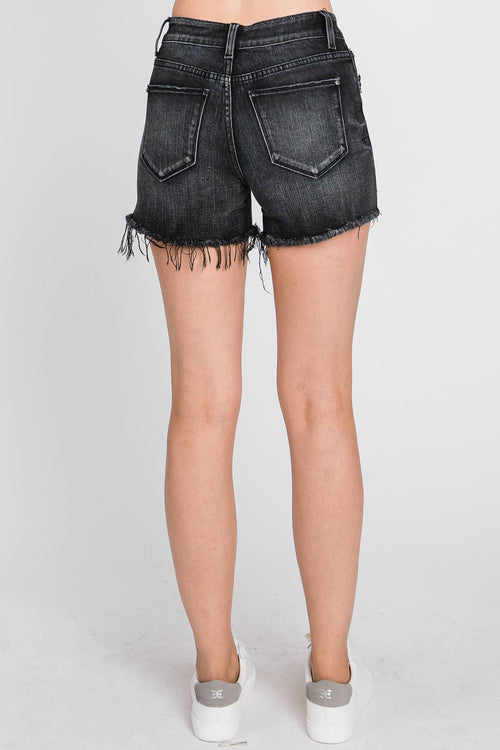 Black denim shorts worn by a person on a white background