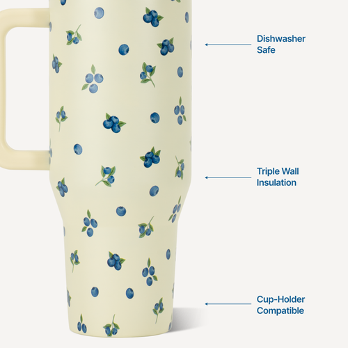 Cream-colored mug with blueberry pattern, labeled for dishwasher safety, triple wall insulation, and cup-holder compatibility.