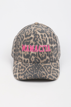 A baseball cap with a beige and gray leopard print pattern, featuring the word 'MAMACITA' embroidered in bright pink across the front.