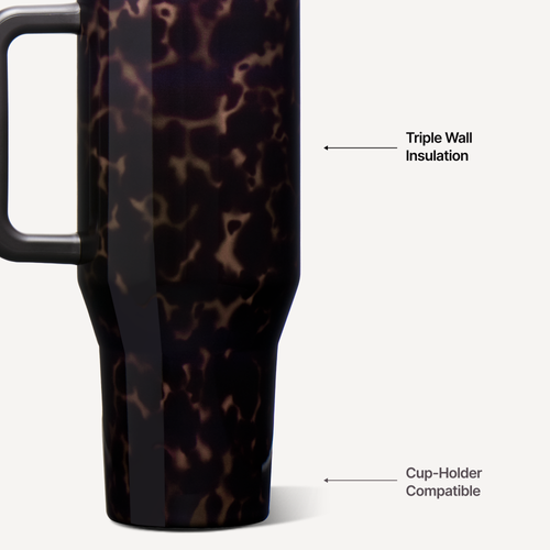 Close-up of a dark travel tumbler with a glossy tortoiseshell-style pattern, featuring callout arrows and text reading 'Triple Wall Insulation' and 'Cup-Holder Compatible' on a light gray background.