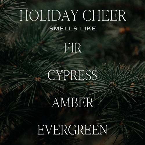 Text overlay on a background of pine branches with the words 'Holiday Cheer Smells Like Fir Cypress Amber Evergreen'.