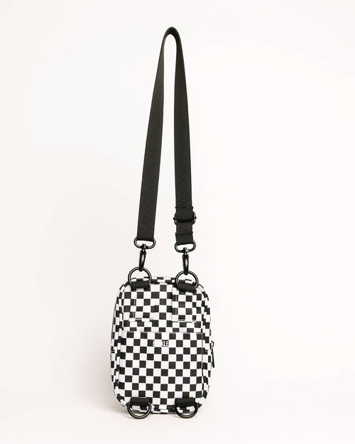 Black and white checkered bag with a strap on a white background