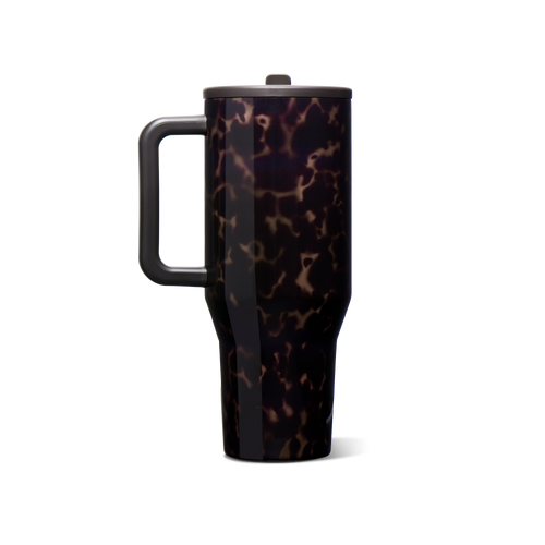 A travel tumbler with a dark tortoiseshell pattern, featuring a black handle and lid, shown on a plain white background.