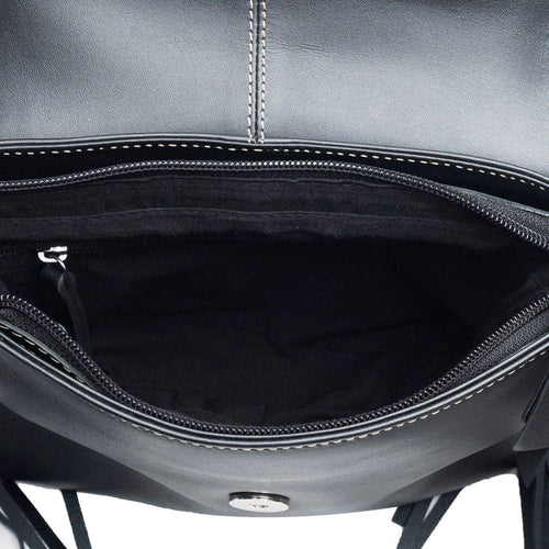 Close-up of a black leather bag with visible stitching on a white background