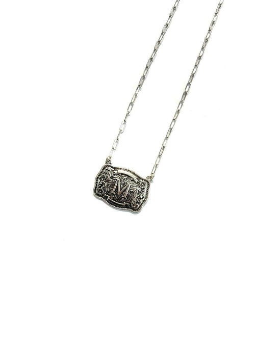 Silver necklace with a rectangular pendant on a white background