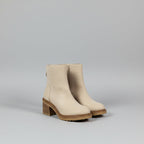 Beige Boots with a gray backdrop
