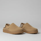 Pair of brown shoes with straps on back on a white background