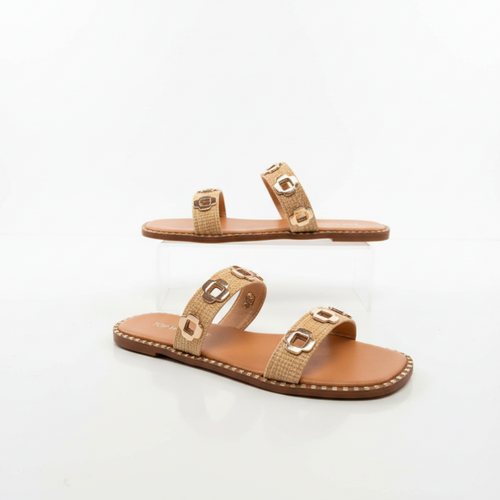 Pair of beige sandals with gold accents on a white background