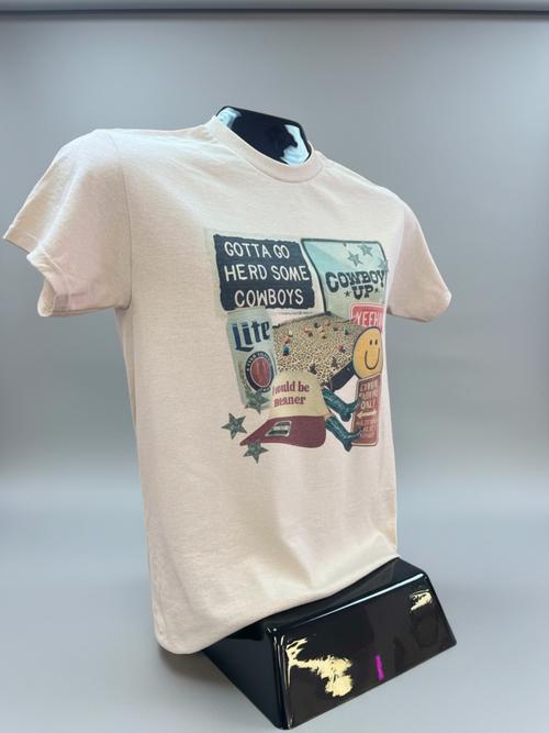 Beige t-shirt with graphic design on a mannequin against a gray background