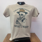 Beige t-shirt with black graphic design and text on a white surface