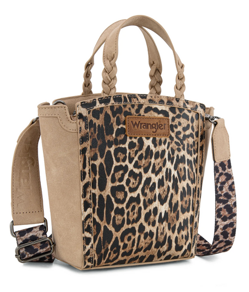 A Wrangler leopard print tote bag with tan faux suede sides, braided top handles, and a matching leopard print shoulder strap on a white background.