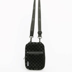 Black checkered crossbody bag with a strap on a white background