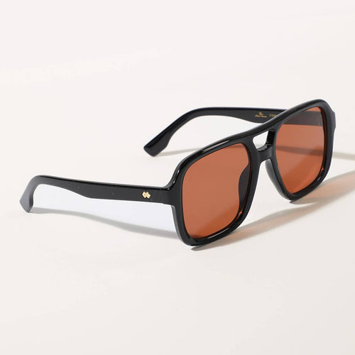 Black sunglasses with brown lenses on a white background