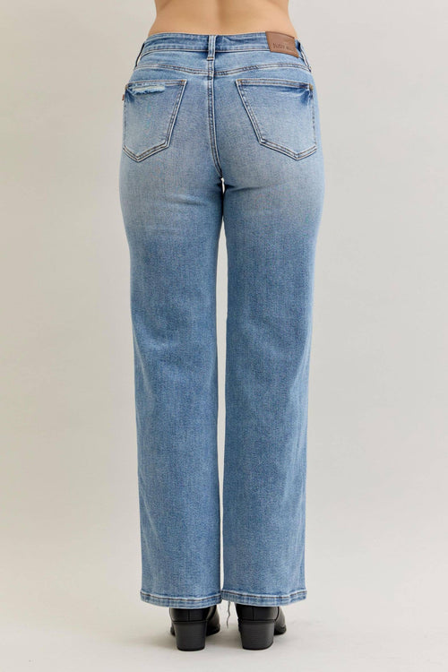 Light blue jeans on a plain background