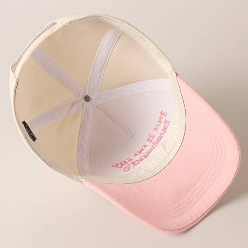 Pink cap with a white interior on a light gray background
