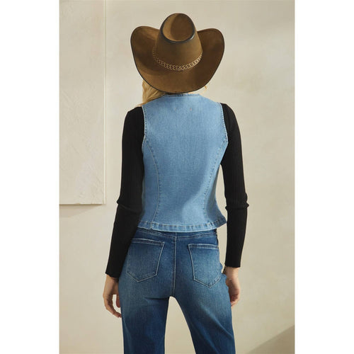 Person wearing a denim vest and cowboy hat from behind on a plain background