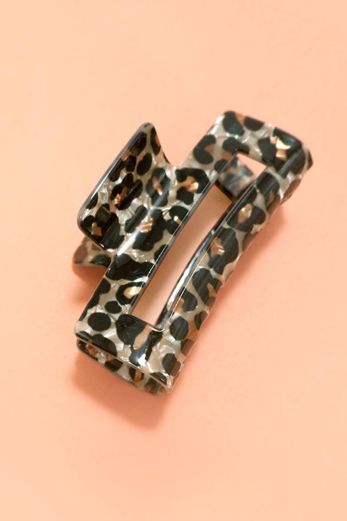 Leopard print belt on a peach background