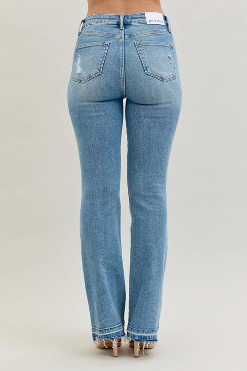 Blue jeans on a plain background