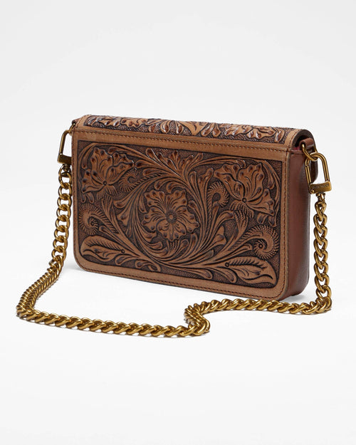 Brown leather handbag with gold chain strap on a white background