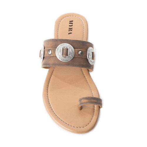 Tan sandal with metallic buckle on a white background
