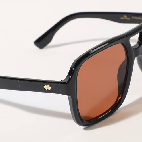 Black sunglasses with brown lenses on a white background