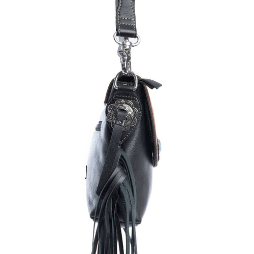Black leather handbag with fringe details and a decorative clasp on a white background