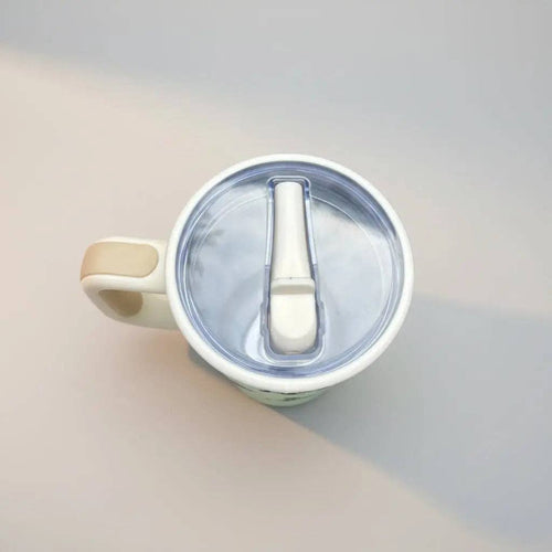Mug with a spoon inside on a gradient background