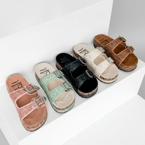 Set of colorful sandals on a white surface