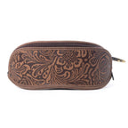 Brown leather case with intricate patterns on a white background