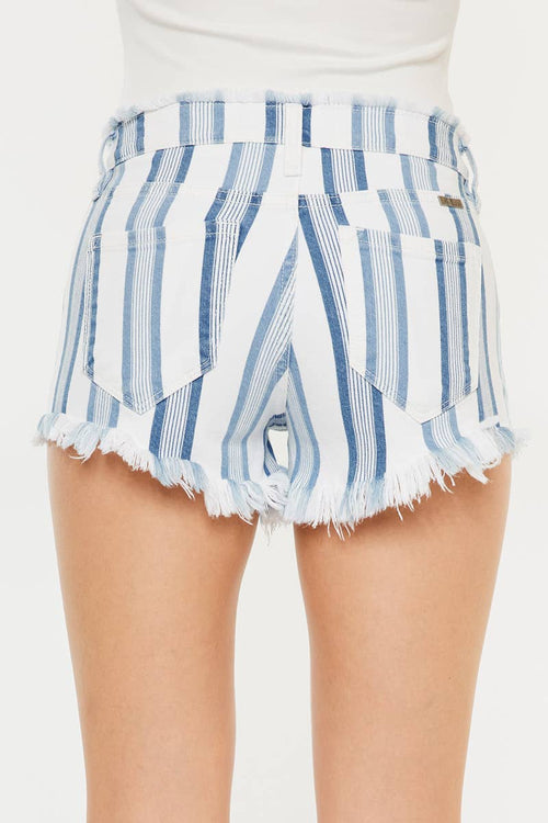Blue and white striped shorts with frayed hem on a plain background