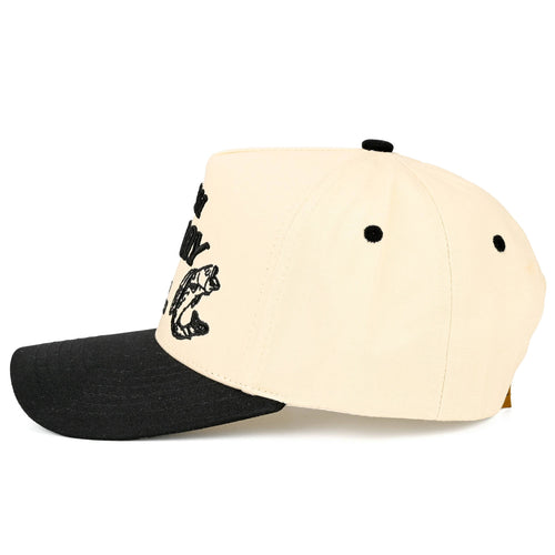 Beige and black hat that says "catch of the day" on a white background 