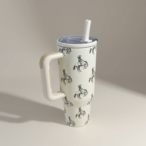 White mug with black patterns on a beige background