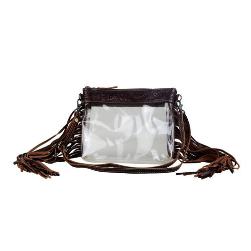 Clear handbag with brown leather straps on a white background