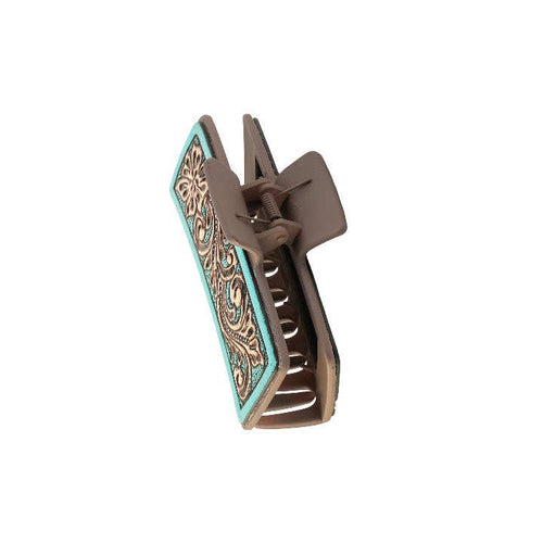 Decorative hair clip with intricate design on a white background