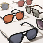 Collection of sunglasses with various lens colors and frames on a white background