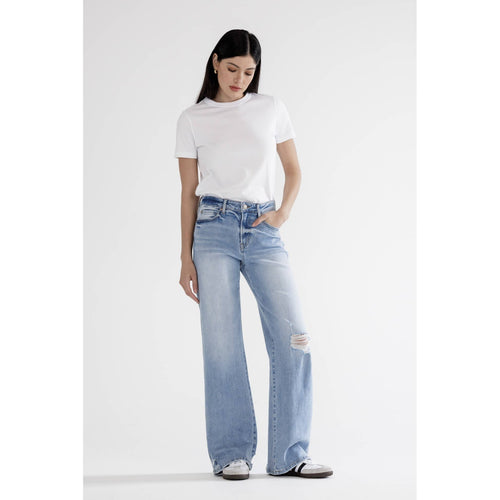 Person wearing a white t-shirt and light blue jeans on a white background