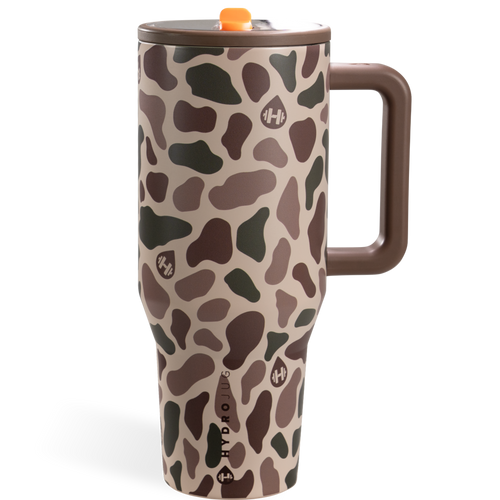HydroJug insulated travel mug with a brown and beige camouflage pattern, featuring a brown handle, brown lid, and an orange accent on the lid.