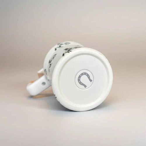 White mug with a circular design on a light gray background