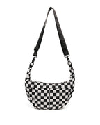 Black and white checkered bag with a strap on a white background