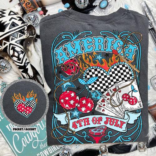 Gray t-shirt with colorful 'America 4th of July' design on a textured surface.