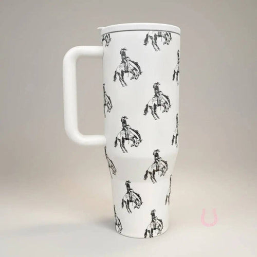 White mug with black horse and rider pattern on a light gray background