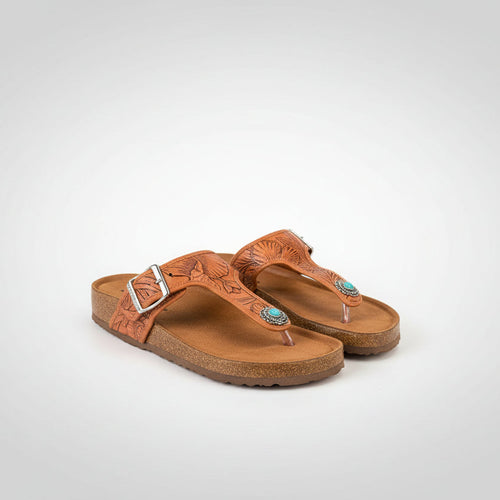 Pair of brown sandals with decorative elements on a white background